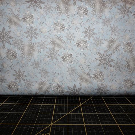 oasis fabrics noel cotton snowflakes with metallic light blue|Noel Collection.